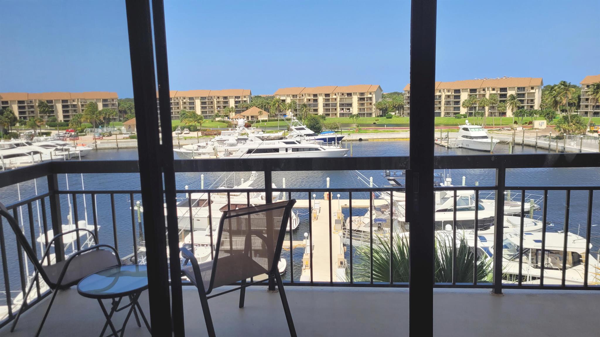 Comfortable, quiet, top-floor corner unit. Relax on one of two balconies with amazing views of the marina. Enjoy fishing or sunset BBQ on the serene Intracoastal waterway in community.Updated kitchen with granite counters. King size bed in master suite, double in guest room & pull out double sofa in living area. Building has elevator. Community has tennis & pickleball courts & several pools. Close to world class beaches, diving, snorkeling, fishing, golf & restaurants. Only twenty minutes to Palm Beach International (PBI) Airport.This furnished turnkey rental is available for $3,000/month June-November. Electric up to $100/month, basic cable & wi-fi also included in rent. W/D in unit.