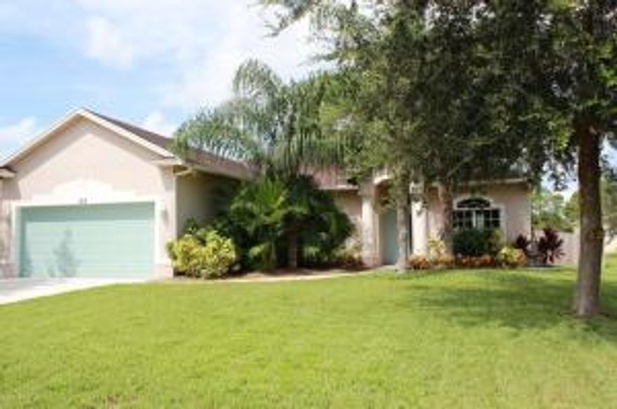 Super energy efficient home built with insulated solid concrete walls. Truss covered screened in back patio. Mature landscaping. 42'' cabinets, corian counters. Huge kitchen. Convenient location; close to I 95, the turnpike, and St. Lucie West.
