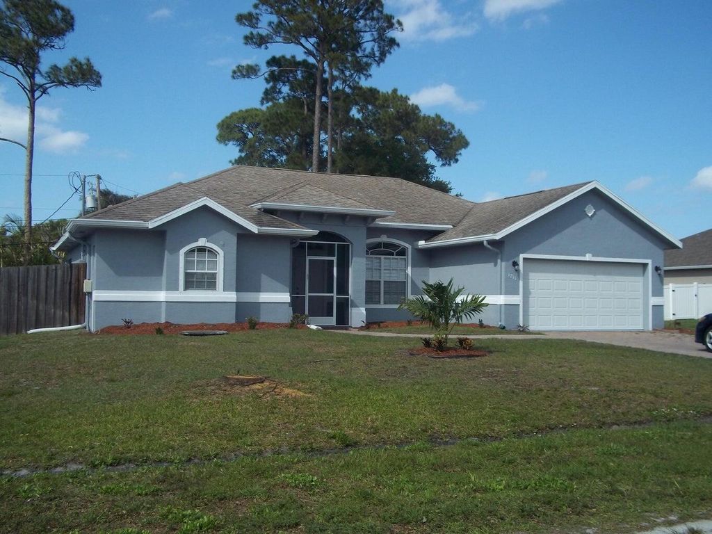 Photo of 1211 SW Wellington Avenue, Port Saint Lucie, FL 34953 (MLS # R11026318)