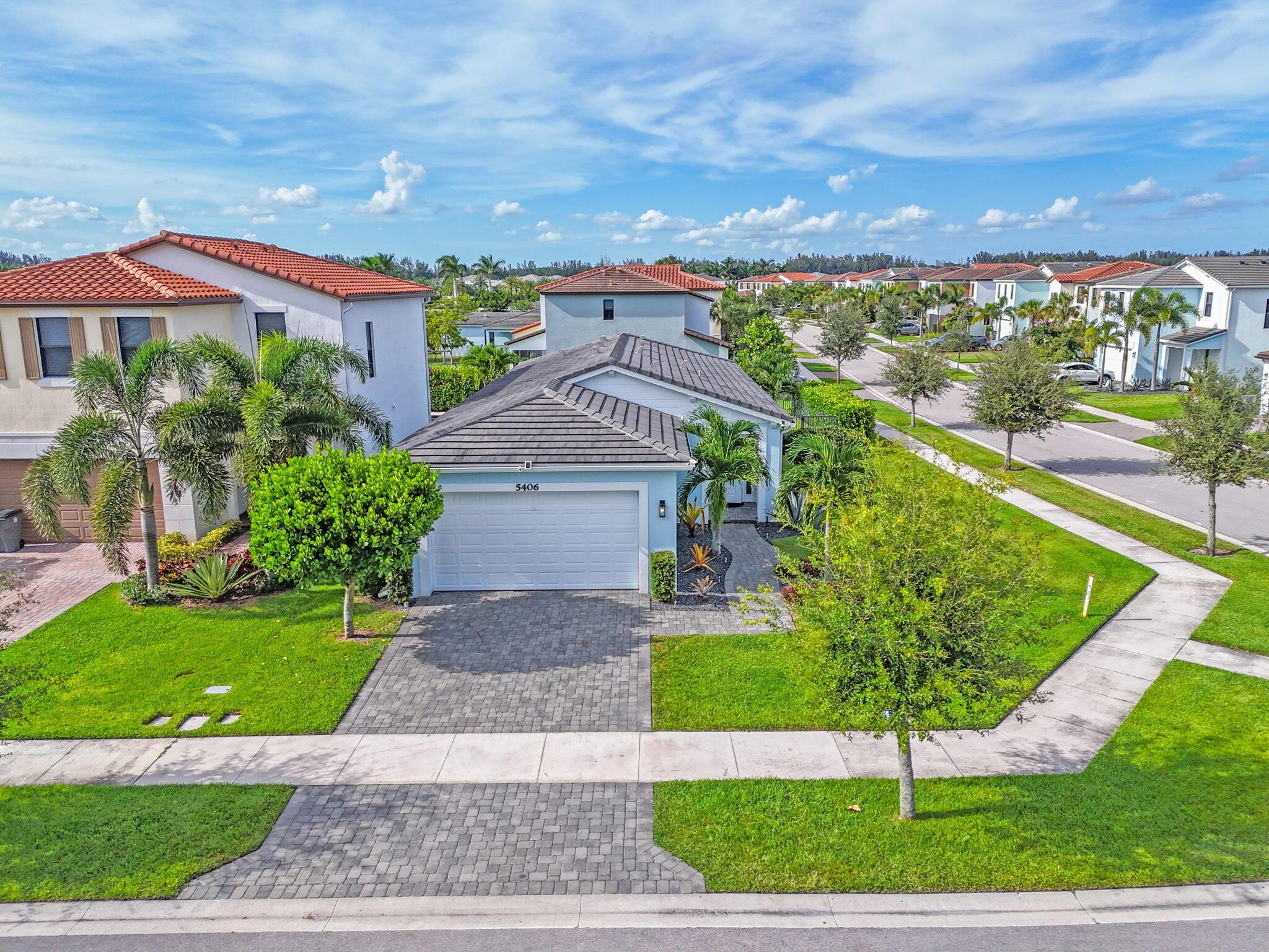 Beautiful West Lake Home Move In Ready!Discover this stunning 3 bedroom, 2 bath split plan home with an open concept design for modern living . Enjoy a Corner Lot, 2 car garage, full impact windows, tropical landscaping stylish finishes, and a bright, airy layout. Close to Publix, restaurants, shopping and A rated schools.