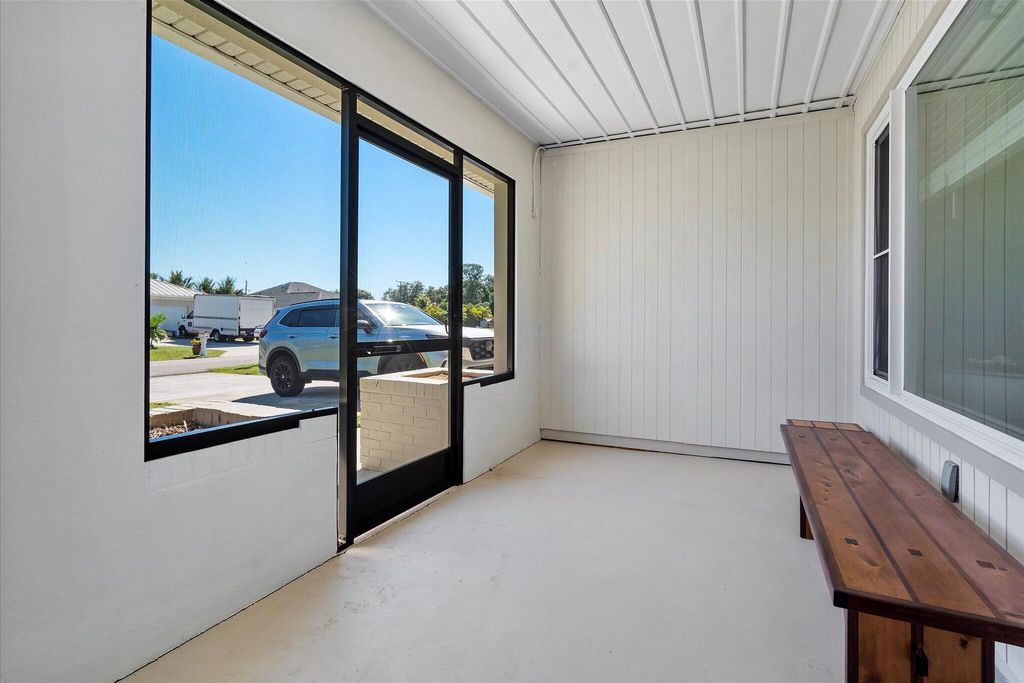 Photo of 409 SE Gasparilla Avenue, Port Saint Lucie, FL 34983 (MLS # R11137399)