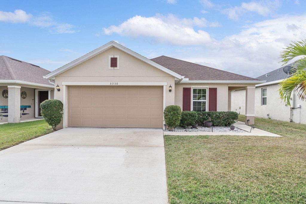 Photo of 5330 NW Pine Trail Circle, Port Saint Lucie, FL 34983 (MLS # B26013790)