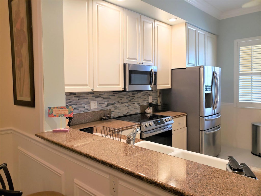 Photo of 37 Harbour Isle Drive E #203, Fort Pierce, FL 34949 (MLS # R10999754)