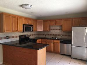 GORGEOUS SPACIOUS TOWNHOME, RENOVATED AND READY FOR MOVE IN. TILE THROUGHOUT LIVING AREA, GRANITE COUNTER TOPS IN KITCHEN AND BATHROOMS, LARGE FENCED PATIO GREAT FOR ENTERTAINMENT AND MORE!
