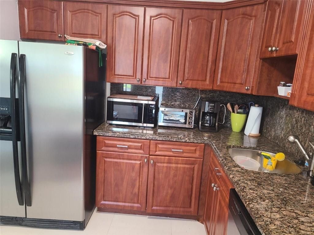 Photo of 3091 N Course Drive #208, Pompano Beach, FL 33069 (MLS # B26026712)
