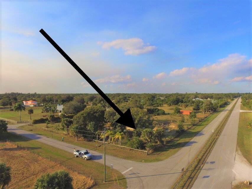 Rarely available 5 acre corner high & dry cleared lot with water, electric & preapproved septic located in this highly sought after community of Wildwood . This property has 2 elevated house pads and the owner has begun to import clean fill for the future development of your future home. This clean fill will save you thousands on your build. This corner lot is completely fenced with a tranquil pond and lovely shade trees. Walking distance from White Fences Equestrian Facility. and located close to Wellington and Polo grounds.