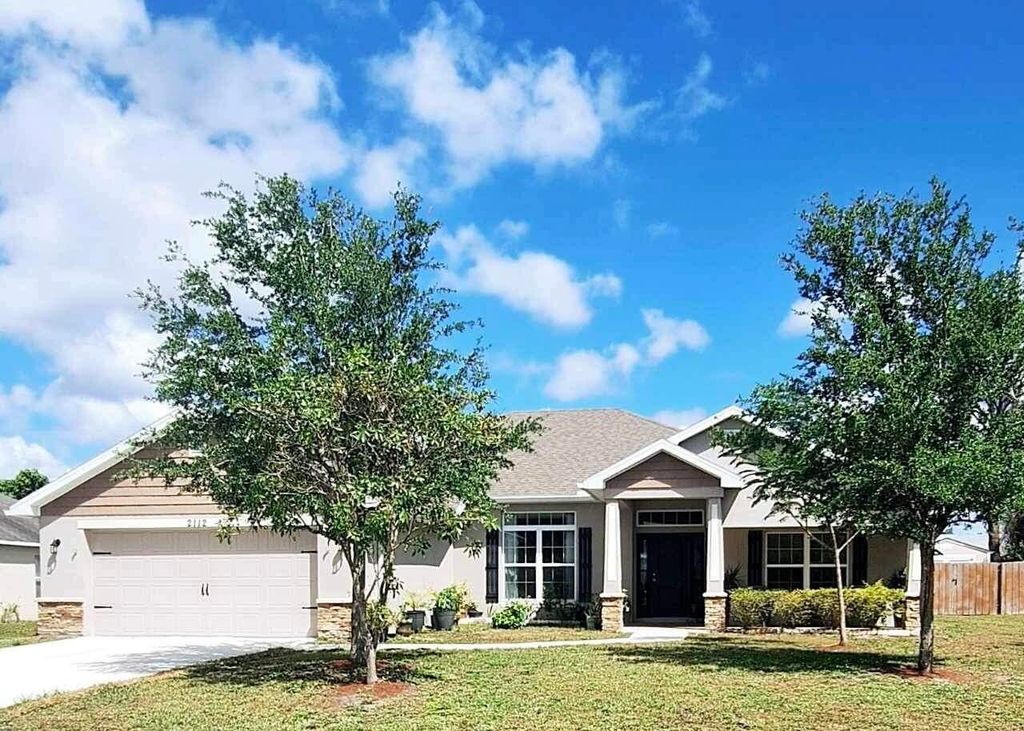 Photo of 2112 SE Holland Street, Port Saint Lucie, FL 34952 (MLS # R10944368)
