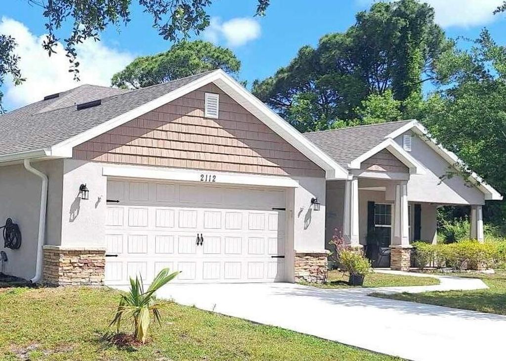 Photo of 2112 SE Holland Street, Port Saint Lucie, FL 34952 (MLS # R10944368)