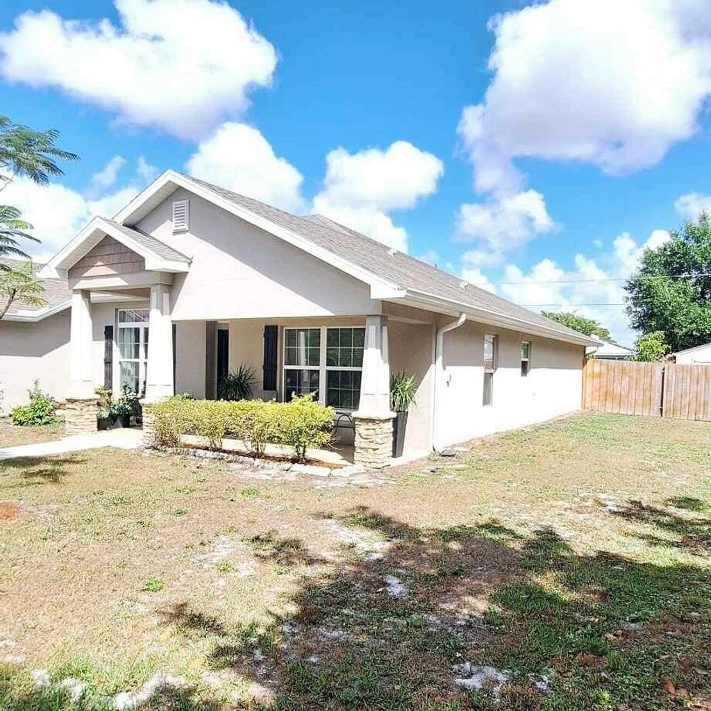 Photo of 2112 SE Holland Street, Port Saint Lucie, FL 34952 (MLS # R10944368)