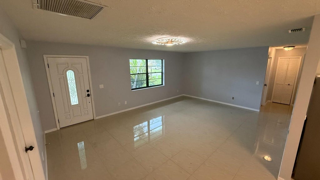 Photo of 1832 SE MANTH Lane, Port Saint Lucie, FL 34983 (MLS # B26071298)
