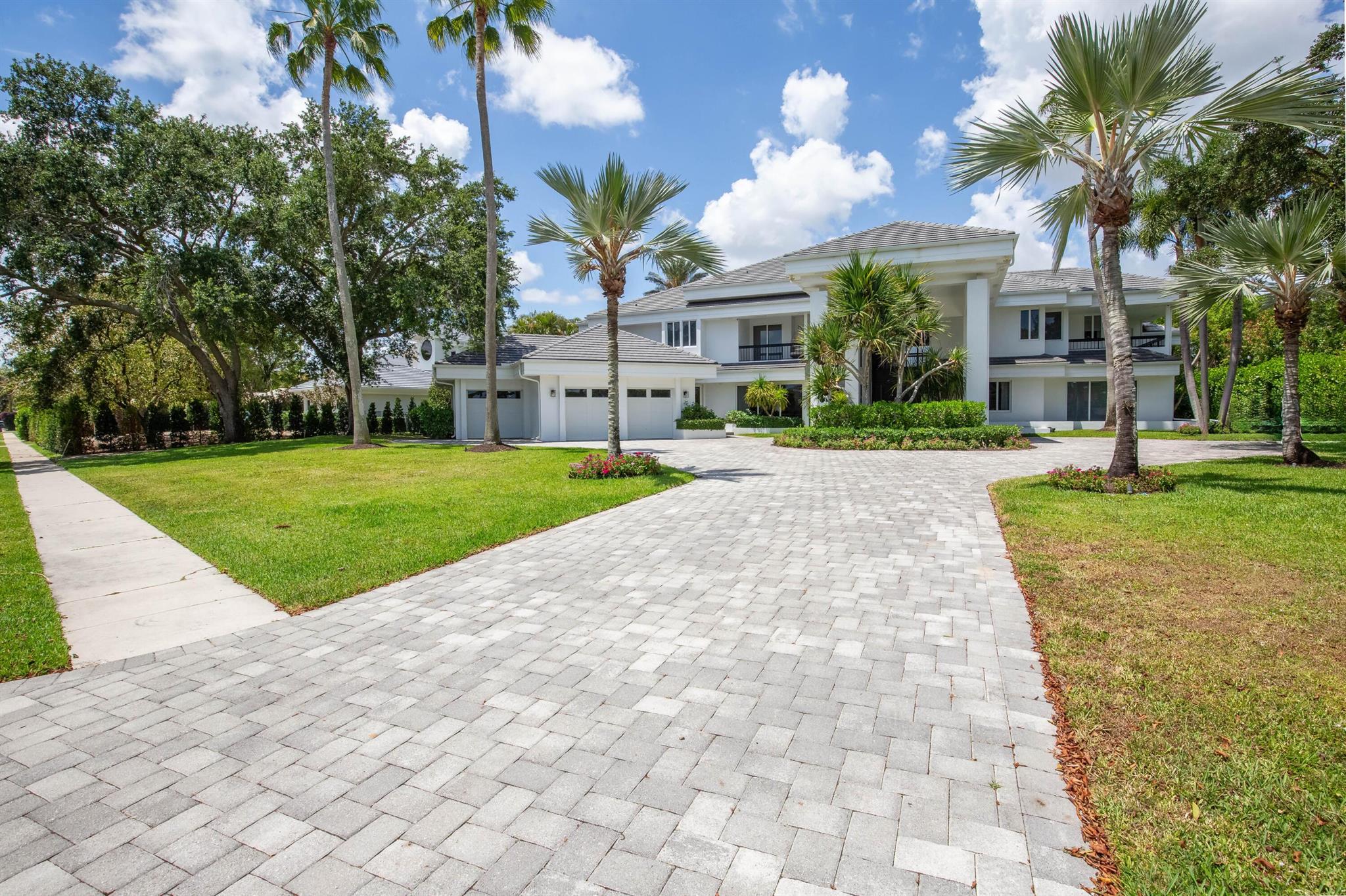 Timeless elegance in Palm Beach Polo & Country Club! This 6BD/6.1BA estate offers over 8,300 sq ft of luxury on a private .83-acre waterfront lot. Soaring ceilings, impact glass, and serene views set the tone throughout. Highlights include a chef's kitchen, grand living spaces, a spacious loft, media room, office, and a 24' x 30' primary suite. Outside, enjoy a heated pool/spa, lush landscaping, and multiple patios--perfect for entertaining. 3-car garage, elevator, and smart security. No membership required.
