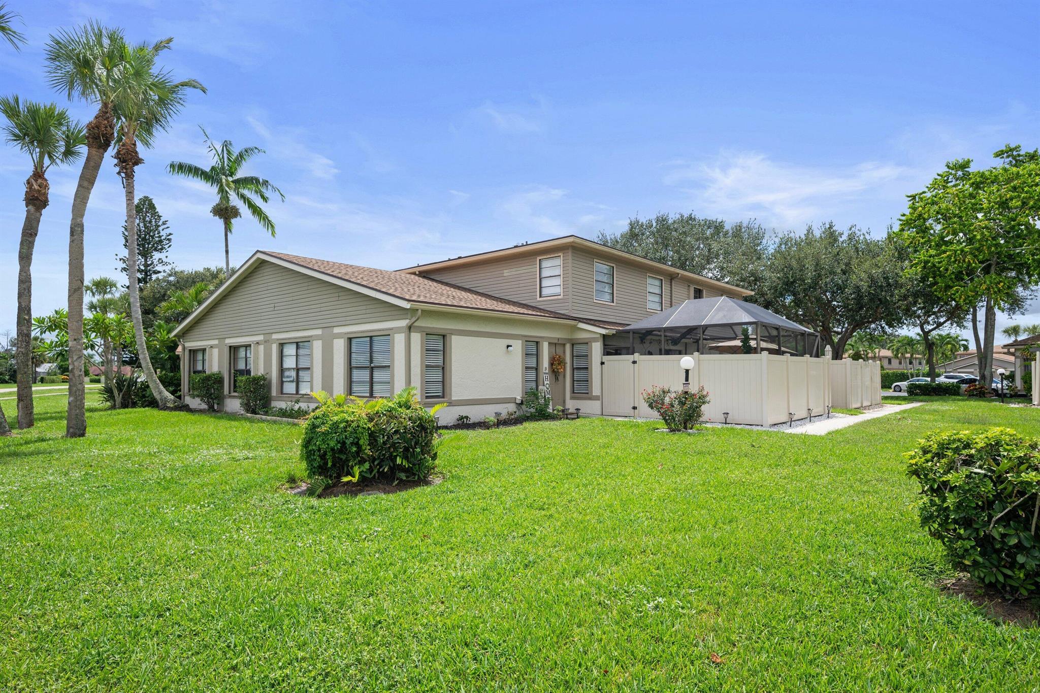 Welcome to this spacious 3 bedroom, 2.5 bathroom corner home featuring a large open floor plan with vaulted ceilings and plenty of natural light. The primary suite is conveniently located on the first floor with private access to the screened-in and fenced patio, perfect for relaxing or entertaining. Updates include a few year-old roof, new water heater (2024), AC (2024). Enjoy access to most green space in the community, plus two assigned parking spots. Just steps from the community pool and packed with amenities: clubhouse, fitness center, library, game room, tennis courts, playground, walking/bike trails. Pet-friendly with NO HOA approval needed! HOA covers basic cable, roof and exterior maintenance, insurance, landscaping, pest control, pool service & more. I95 & turnpike min away.