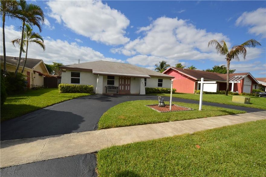 First time on the market. Nicely updated single family home featuring 4 bedrooms 3 baths. Remodeled in 2013 addition with permits(4th room additional master suite/in law quarters with its own walk-in closet & private bathroom).  Expanded and remodeled kitchen including wood cabinets, granite counter tops, center island and Stainless-steel appliances, plus built-in standalone freezer. Home also features Impact windows and doors. Large living areas with oversized living room & family room. Circular driveway. Large back yard with Storage shed and room for a pool overlooking canal. Low taxes no association. Home is in mint condition original owners.