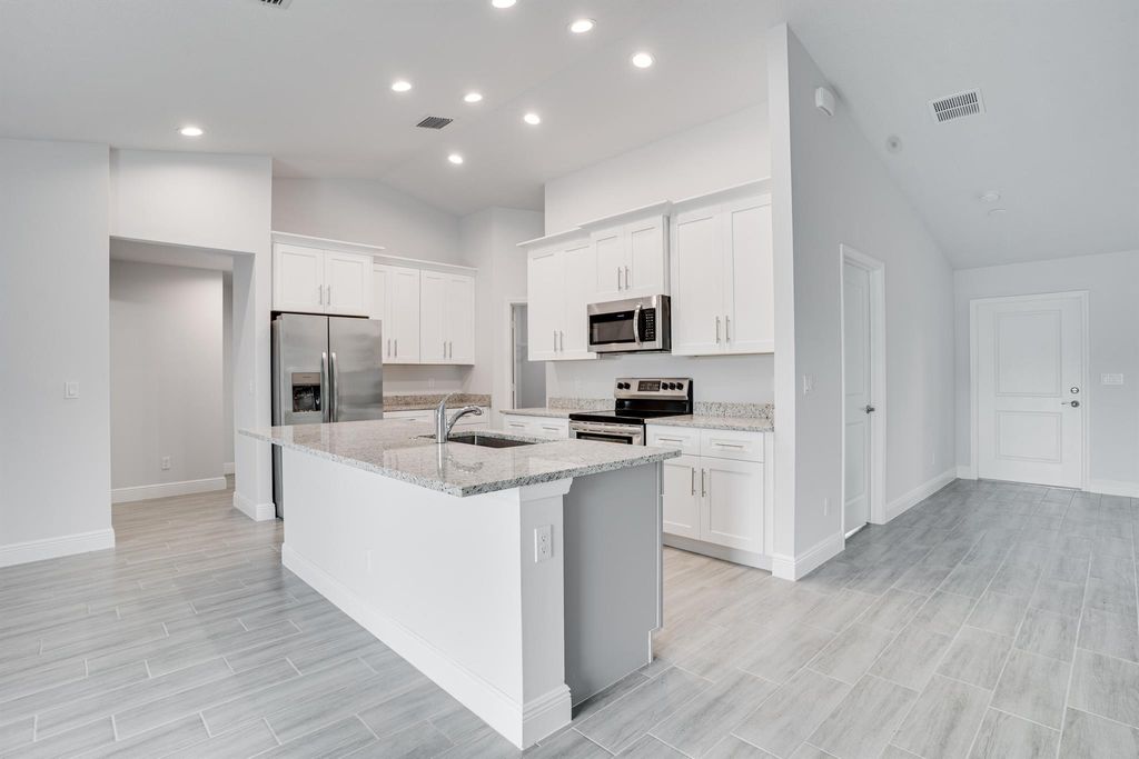 Photo of 1722 SW Lofgren Avenue, Port Saint Lucie, FL 34953 (MLS # R10903451)