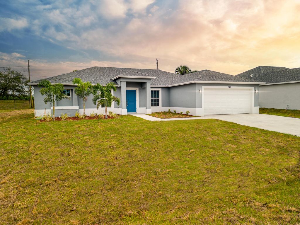 Photo of 1722 SW Lofgren Avenue, Port Saint Lucie, FL 34953 (MLS # R10903451)