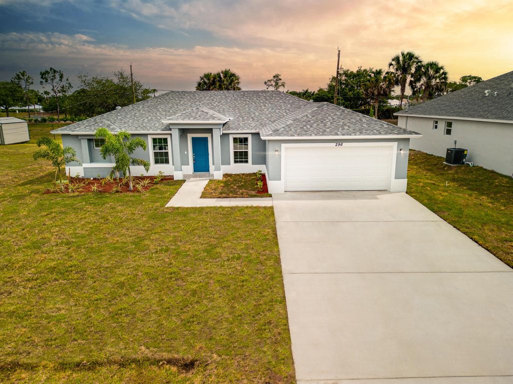 Photo of 1722 SW Lofgren Avenue, Port Saint Lucie, FL 34953 (MLS # R10903451)