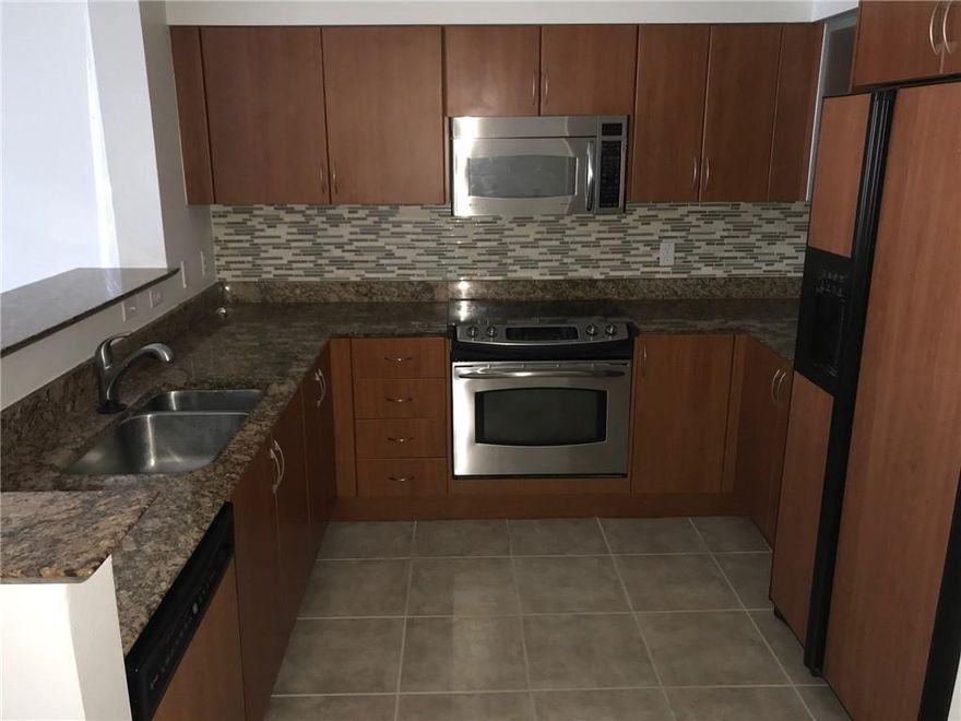 This beautiful 2 bedroom 2 bathroom condo comes complete with laminate wood floors throughout, upgraded kitchen and appliances, full sized washer and dryer, and an oversized corner balcony. The Moorings of Lantana is a waterfront community with a full marina; Loggerhead Marina. Community features include onsite management, two pools, two hot tubs, a state of the art gym, his and hers saunas, conference room, billiard room, library, club room with kitchen(for events), valet from 6am-12am, 24 hour security and more!Enjoy the best in Florida living directly on the Intracoastal.