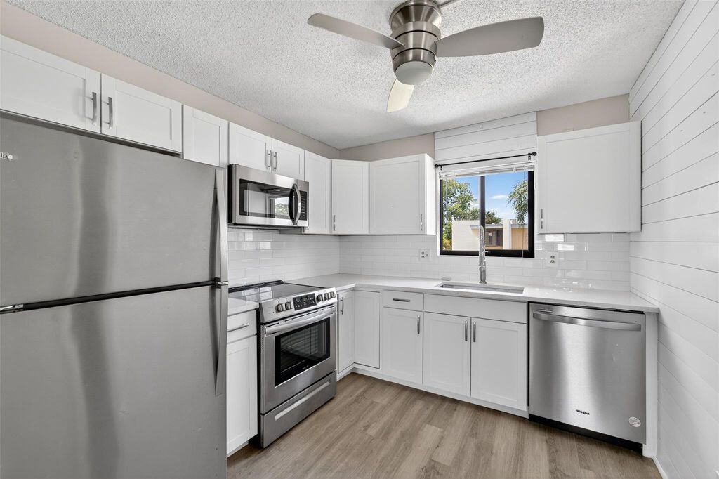 Photo of 1551 NE 13th Ter #A14, Jensen Beach, FL 34957 (MLS # F10518338)