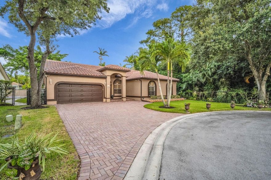 Welcome to your future home! This stunning property sits right next to a natural preserve full of nature and privacy on a quiet cul-de-sac, this home features vaulted ceilings and a bright, open-concept kitchen with granite countertops and 2022 stainless steel appliances. Enjoy seamless indoor-outdoor living with a private, screen-enclosed salt water pool, perfect for relaxing or entertaining. The primary bathroom includes a convenient cabana door, offering direct pool access. Additional highlights include an impact-rated garage door and accordion shutters along the back for added storm protection. A beautifully designed home combining comfort, function, and peace of mind. 2024 spanish tile roof, 2019 A/C with 10 year warranty, 2024 gutters, 2024 w/d, electric connection to generator.