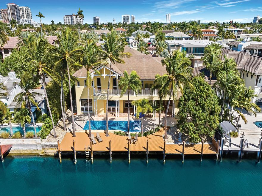 Luxury redefined in this transitional contemporary estate, situated in the southern waterways of the Las Olas Isles, boasting 100' of deep waterfront & no fixed bridges to the ocean. Unrivaled architecture, construction & attention to details for those who enjoy an elevated lifestyle. This luxurious residence is enhance by vaulted & coffered ceilings & large luminous spaces for entertaining. The gourmet kitchen will inspire those who love to cook. The lavish primary suite offers a sitting area, fireplace, spa inspired bathroom, walk-in closet & access to a waterside balcony. Additional details: separate guest quarters, a home office, 2nd floor family room, 1st & 2nd floor laundry rooms. A large lanai with summer kitchen overlooks the pool, patio and waterway. Sq ft from architectural plans