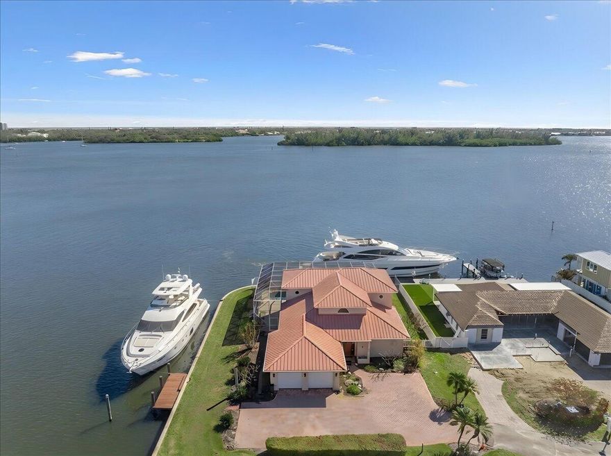 WELCOME TO VERO ISLES — A BOATER'S DREAM

 Rare deep-water northeast riverfront point lot in the heart of Vero Beach. One of Vero Isles' best lots, this exceptional property offers over 200° of wide water views with direct access to the Indian River and Intracoastal, ideal for serious boaters. Just steps from the future Three Corners Project, this prime location combines privacy, convenience, and long-term value.

The solid concrete block 4BR/3BA/2-car garage pool home features a metal roof, impact windows, roll-down shutters on the second floor, and a whole-house generator for added peace of mind. A premier riverfront setting with deep water, expansive views, and endless potential.