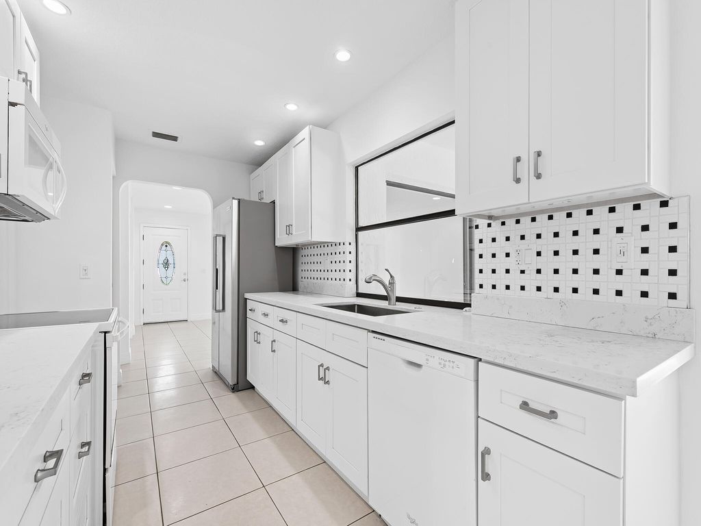 Photo of 14718 Shadow Wood Lane, Delray Beach, FL 33484 (MLS # R11050707)