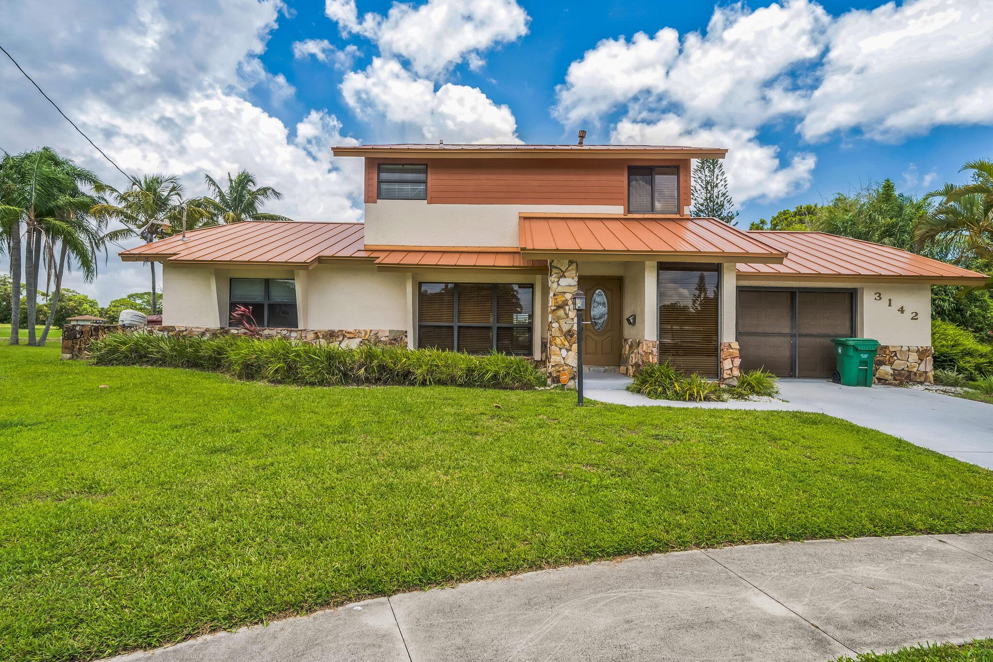 Charming 3 bedroom, 2 bathroom CBS construction home located within the highly desirable Sandpiper Bay community! Home backs up to the golf course with beautiful views! This Spacious 2,042sqft home offers a large interior space for entertaining, lovely kitchen with plenty of space and natural light, beautiful and large upstairs deck with a view, an attached garage, and lovely enclosed patio space for entertaining! This spacious outdoor area provides the perfect setting for enjoying the Florida Lifestyle,All with no HOA fees! Metal roofing, impact windows and doors throughout. This Home is Located Within Minutes of Golf Courses and Shopping! Sandpiper Bay is an established Destination Community where pride of ownership lives on every street.