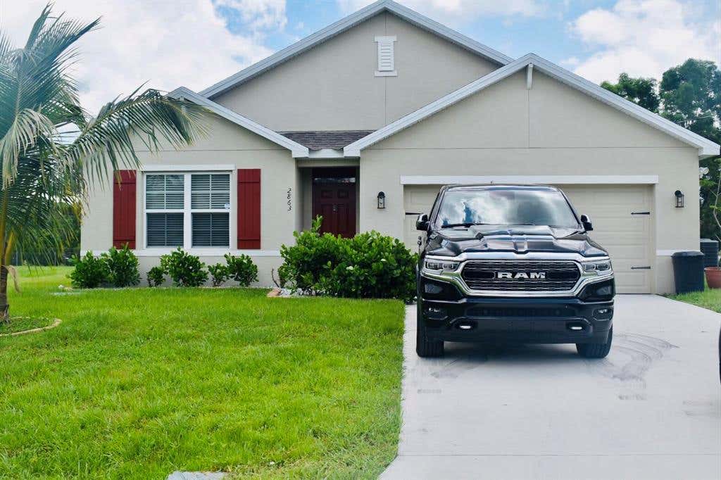 Photo of 2863 SW Ann Arbor Road, Port Saint Lucie, FL 34953 (MLS # R10733799)