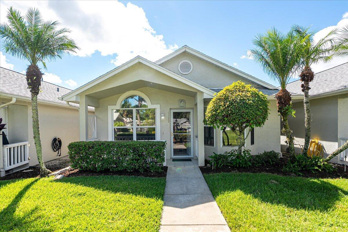 Discover one of the best values in Kings Isle! This 2-bed, 2-bath villa is set on a rare waterfront lot with peaceful lake views and easy-maintenance living; perfect for full-time residents, snowbirds, or anyone looking to downsize without sacrificing location. Instead of paying for upgrades you may not want, start with a clean canvas and personalize it to your taste. The screened patio overlooks the water, offering a quiet retreat for morning coffee or evening sunsets. Kings Isle is a gated 55+ community with resort-style pools, clubhouse, fitness, tennis, pickleball, clubs, and a full calendar of social activities. Minutes to shopping, dining, medical facilities, I-95, and all the conveniences of St. Lucie West--affordable lakefront living with endless potential!