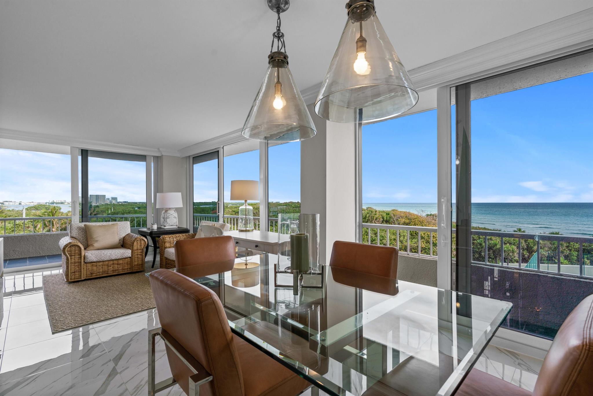 Welcome to your waterfront home at Water Glades on Singer Island, where direct ocean views await just beyond the sliding glass doors. Available furnished or unfurnished. Both sights of the intracoastal and the ocean, enjoy the breathtaking sunrises, this 2-bedroom, 2-bath ''beachy'' condo has to offer. Ideally situated just a short drive or walk from the bars, shops, and restaurants on PGA Blvd. It's the first condo complex next to John D. MacArthur State Park. Enjoy the water from both bedrooms and a newly installed kitchen. Available for seasonal rent at $7,500 per month or annually at $4,500 per month. Come take a look!