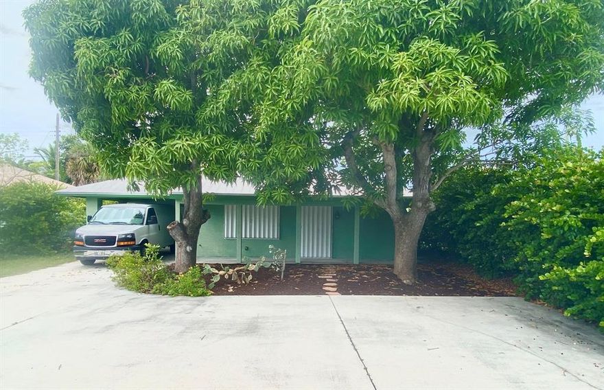 Unique Opportunity-- Zoned Mixed Use Commercial high visibility location directly on Federal Hwy. Great for small business. Currently used as single family home. CBS construction with accordian shutters protection and metal roof. Built to withstand the elements. Open floor plan with spacious kitchen. Nice outside front patio space with mature landscaping. 1 car garage plus carport.