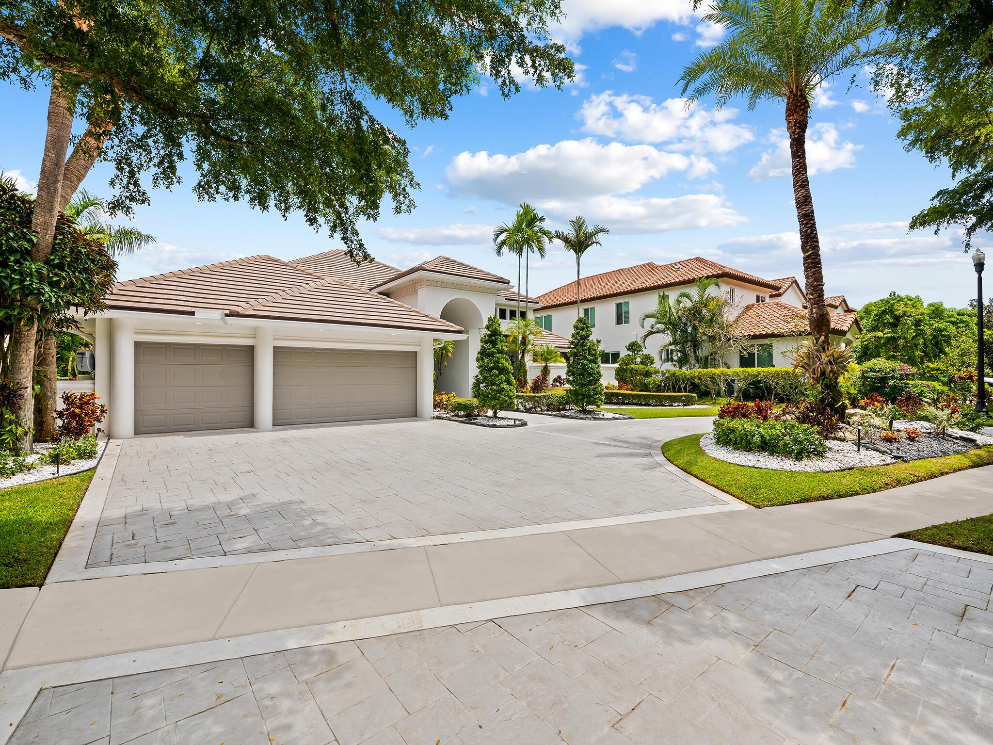Beautiful east facing ranch style estate on an oversized 14,000 Sq/Ft lakefront lot in the highly sought-after manned gated Parkside community. This custom built home boasts 14-foot-high ceilings, a split floor plan with 4 bedrooms plus an office and 3.5 baths. Also this home offers a generous living space, an oversized 3-car garage with new poxy floors, 2019 roof and upgraded impact windows and doors throughout. Parkside itself offers tree-lined streets and an excellent location, with amenities including a clubhouse, tennis courts, pickle ball, andseveral playgrounds. Conveniently located next to the renowned Sugar Sand Park, providing endless opportunities for outdoor activities. I95 access, Town Center Mall, Downtown Boca Raton, and our pristine beaches all minutes away!