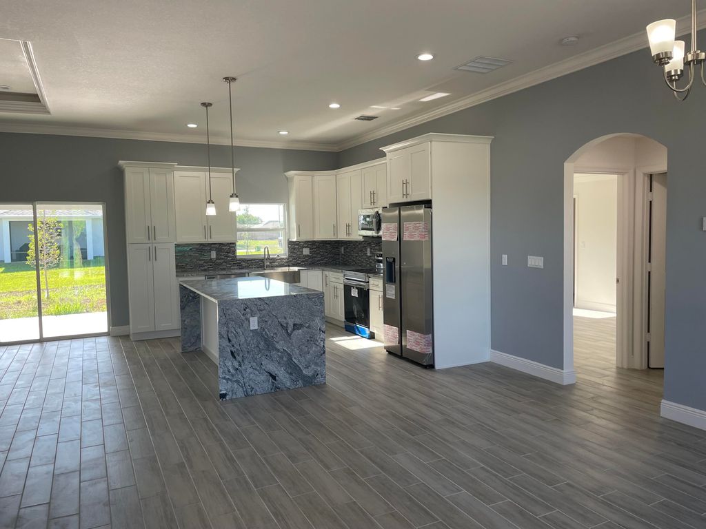 Photo of 1189 SW Khan Drive, Port Saint Lucie, FL 34953 (MLS # R10957657)