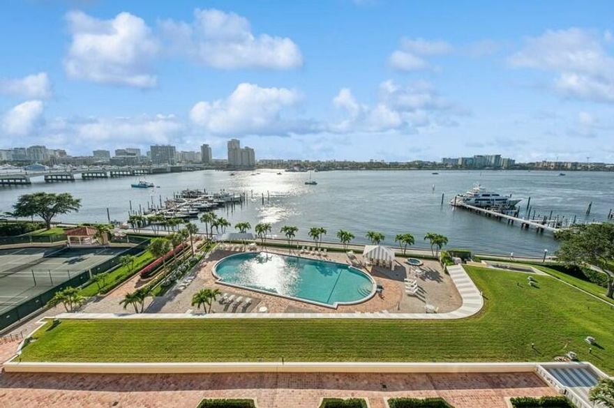 This spacious over 1800 sf residence at the iconic PB Biltmore offers sweeping views of the Intracoastal Waterway & lush courtyard gardens. Currently undergoing tasteful updates, including new impact windows, the home is bathed in warm southern light throughout the day. The open-concept living and kitchen areas are perfect for both relaxing and entertaining, while the generous primary suite provides a tranquil retreat w/ water views. Easily add a den or third bedroom to the oversized living space. A 2 BR condo next door is also available  Enjoy five-star service alongside the ultimate in-town convenience, with walking access toshopping, fine dining & beach. An unparalleled array of amenities, incl the hidden gem, a private oceanfront club with dining and beach access. Pet friendly too!