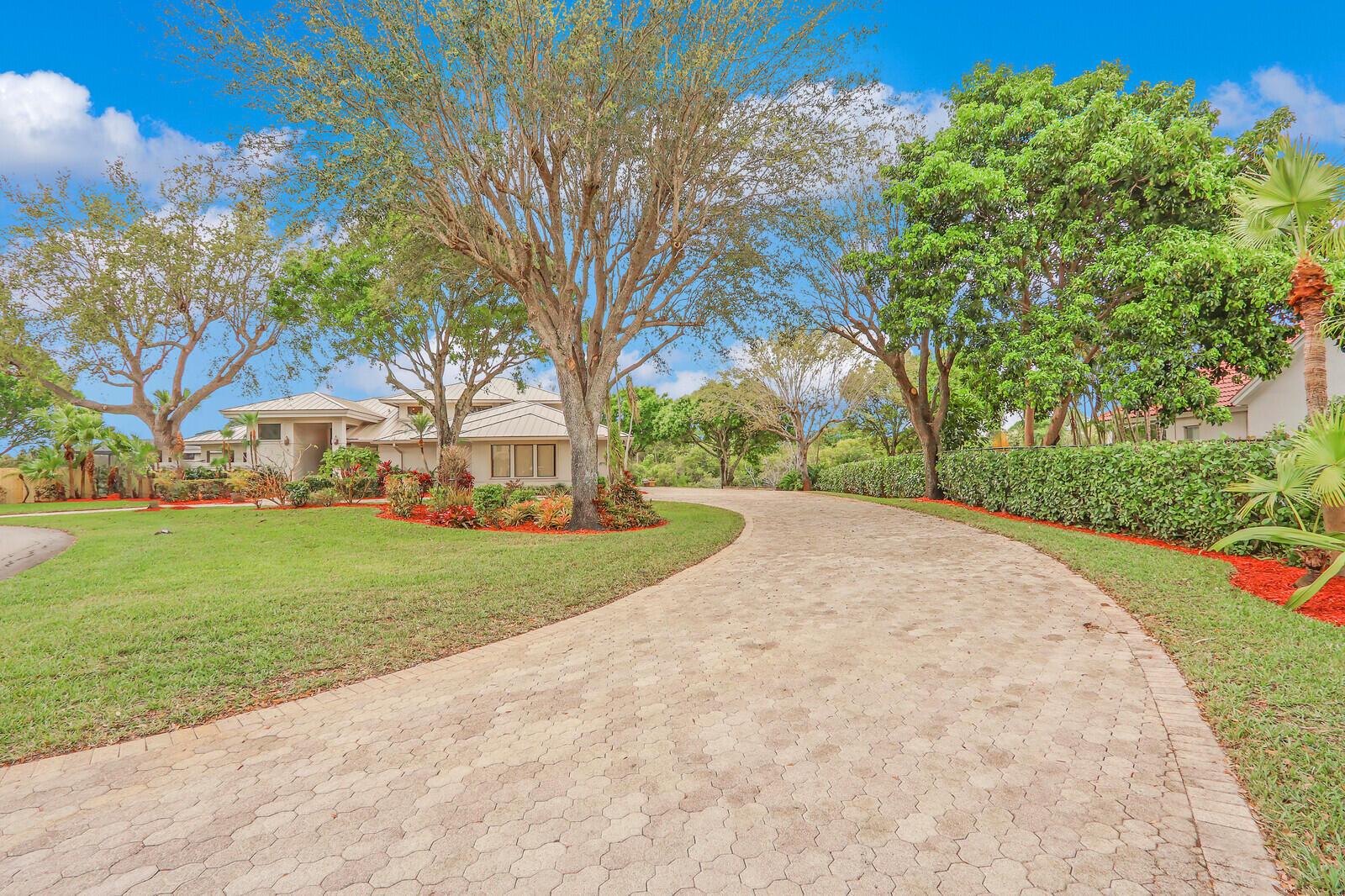 Welcome to Four Rivers, a serene waterfront community nestled along the South Fork of the St Lucie River. The community is renowned for its deep-water canals, providing residents with direct access to the Atlantic Ocean. The neighborhood is characterized by its winding roads, lined with mature trees and meticulously maintained landscaping, creating a tranquil environment. Expansive windows fill the space with natural light, showcasing panoramic views of the St Lucie River. The open concept features high ceilings, a cozy fireplace and seamlessly blending indoor and outdoor living. A spacious deck and private dock provide for morning coffee and sunset gatherings. Luxurious Bedrooms and spa-like bathrooms. This home is an idyllic haven for relaxation and entertainment.