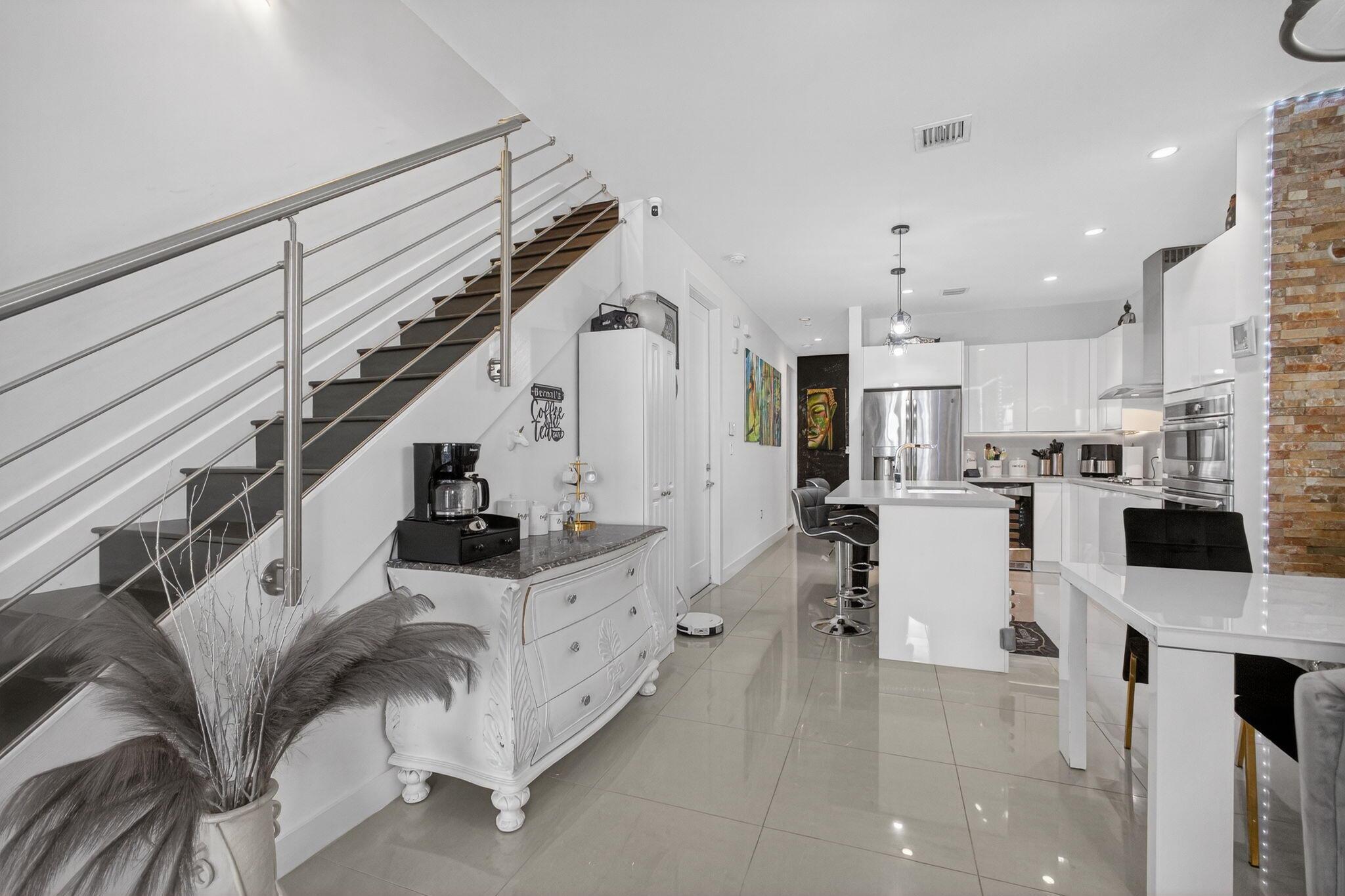 Welcome to Landmark at Doral. This 3 bedroom, 3 bathroom townhouse, with 1 car garage is sure to impress! Modern design in bathrooms and kitchen, which includes deluxe stainless steel appliances and quartz countertops. All bedrooms feature walk in closets. Ample additional closets near kitchen and garage. The state of the art community features swimming pool, tot swimming pool, tennis courts, billiards room, fitness center, sauna and outdoor grilling area.