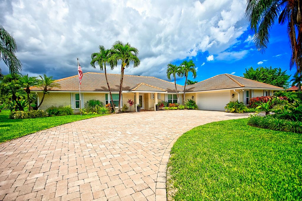 Photo of 455 S Country Club Drive, Atlantis, FL 33462 (MLS # R11161456)