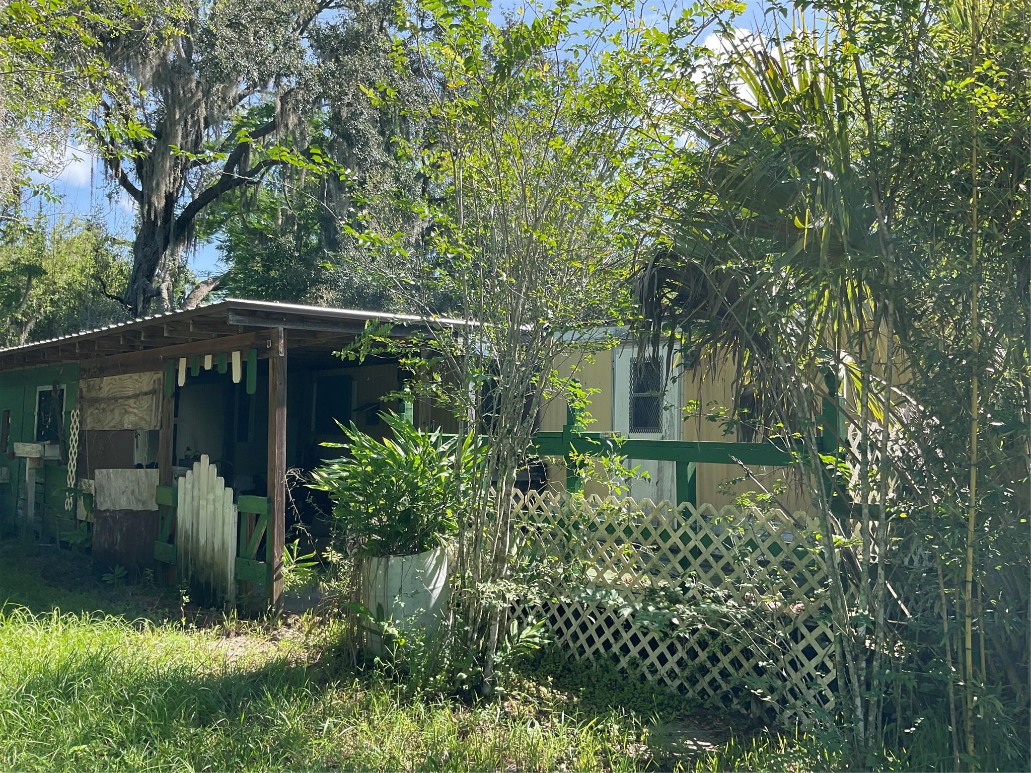 Zoned Commercial - 4.45 High & Dry Acres located in Ft Drum- Over 300' Highway 441N frontage- Fenced with two gated entrances - 3 wells - 1 potable- 2- irrigation - 1983 singlewide mobile home with electric & septic -mobile home needs repair or replacement - 2004 pole barn with electric-property may be divided - Multiple options for Future Use-Contact Okeechobee County planning and zoning for more information. All measurements approximate. Call Today!