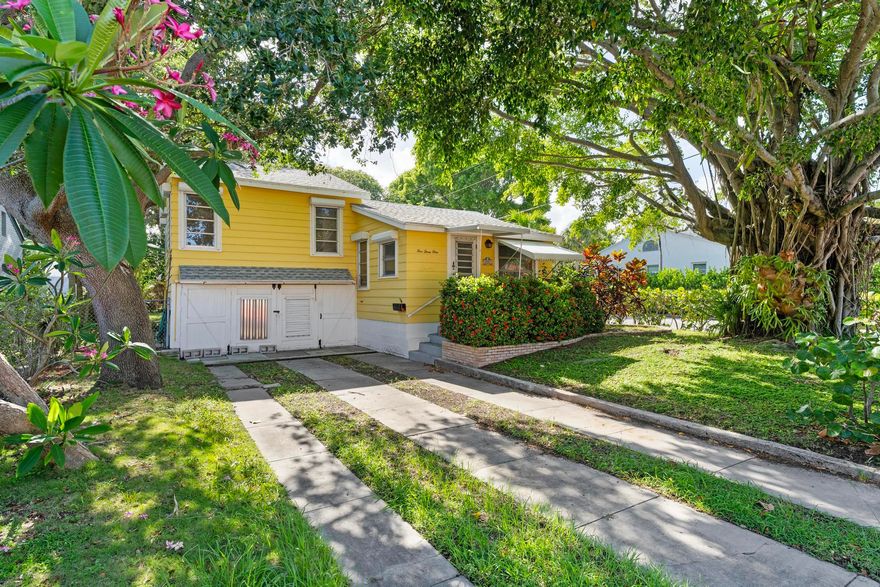 Tucked away in a peaceful tropical setting, this charming cottage-style home blends comfort with everyday convenience. Offering two bedrooms and two bathrooms, the home features a spacious layout and a warm, welcoming ambiance throughout. Enjoy a large yard perfect for entertaining or relaxing outdoors, along with a two-car garage that provides plenty of storage and parking.  Ideally situated just minutes from the beach and vibrant downtown Lake Worth, you'll have easy access to dining, shopping, and local attractions. This inviting property is a wonderful opportunity to own a slice of paradise in one of Lake Worth Beach's most desirable neighborhoods.