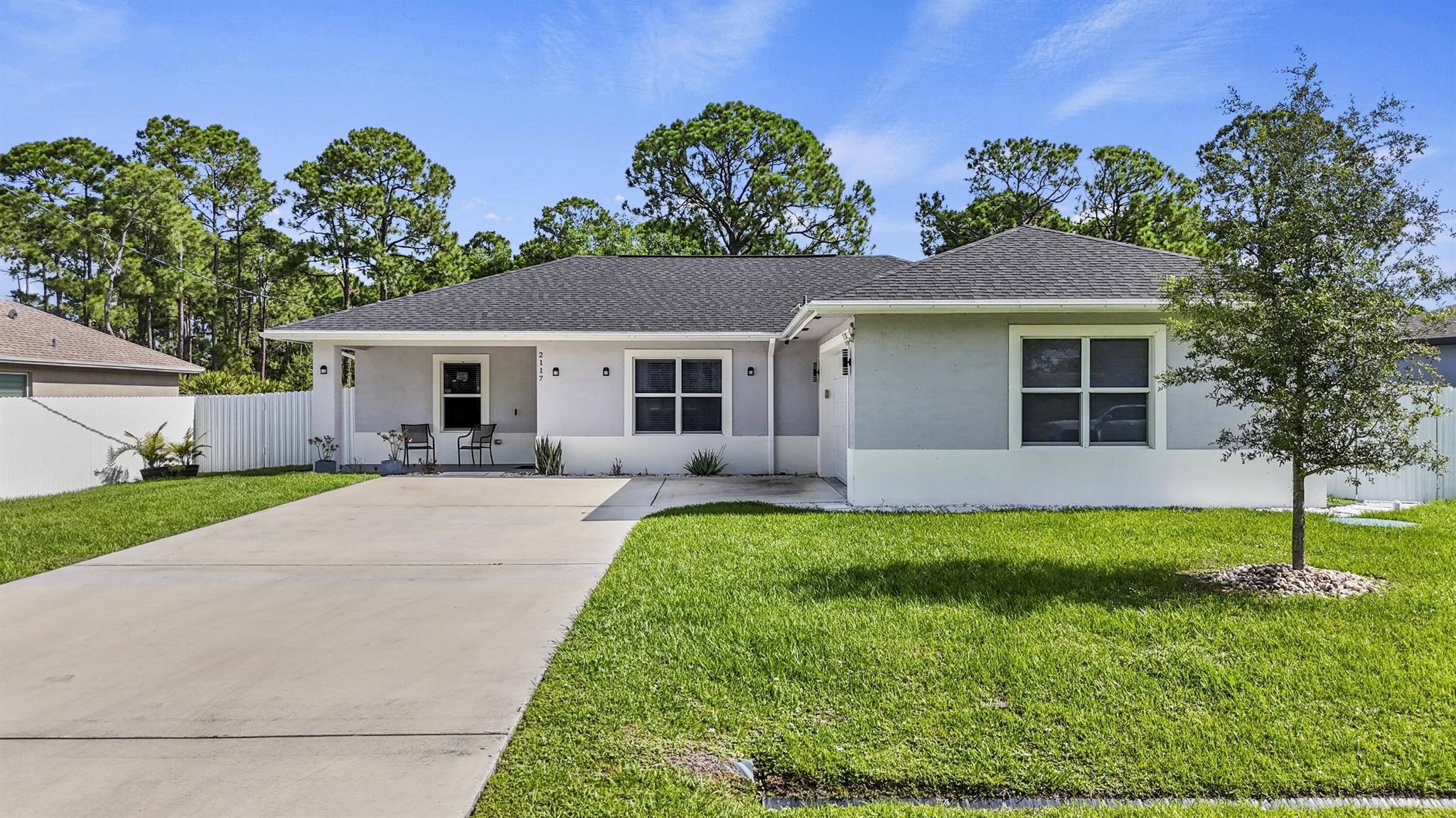 📍Location, Location, Location!Just minutes from the prestigious city of Tradition, this home offers a prime location -- close to I‑95 and the Turnpike, with fast access while maintaining peace and privacy.This newly built home showcases a contemporary design, elegant porcelain tile floors, and open, light-filled interiors -- ideal for both everyday living and stylish entertaining.Step outside to a fully fenced backyard with a durable metal fence for added privacy and security. The outdoor space is a true highlight, featuring a dedicated BBQ area, a pergola with a retractable roof over a spacious covered porch, and a beautiful above-ground pool with deck -- the perfect setup to enjoy Florida living at its best.