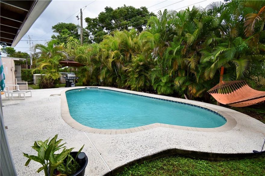 Great Pool home in a family friendly community! This home has a beautiful oasis in the back yard, with plenty of room to host friends and family for entertainment. Tons of storage, shed located by the pool can be converted into a SHE shed or for your lawn mower/tools/yard stuff and pool supplies. Conveniently located next to shopping, groceries, stores and much more. High impact windows were recently installed with all new doors.This spacious circular driveway can hold up to 6 cars, great location, a few updates, this dream home can be yours!