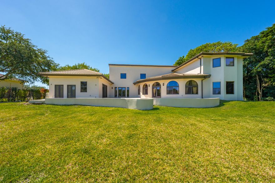 Introducing a truly exceptional custom home nestled within the prestigious enclave of Sunshine Ranches, meticulously crafted by an esteemed designer holding degrees from both Harvard and Yale. This magnificent residence boasts a grand total of 5 spacious bedrooms, including 3 luxurious master suites, providing unparalleled comfort and opulence. Embrace the versatility of a separate office/den, which can effortlessly transform into a 6th bedroom to suit your needs. Delight in the presence of a generously proportioned media room, ideal for entertainment and relaxation, while the separate maid's quarters offer added convenience and privacy. Step into the breathtaking sunroom, a serene haven overlooking your vast and secluded backyard sprawling across nearly 2.5 acres. Multiple verandas verandas adorn the exterior, offering charming outdoor spaces to savor the tranquility and lush surroundings. Indulge in the exquisite architectural details that adorn every corner of this residence, reflecting unparalleled craftsmanship and sophistication. Conveniently located mere minutes away from major highways, renowned dining establishments, upscale shopping destinations, prestigious hospitals, and top-rated schools, this home epitomizes luxury living with effortless accessibility. Don't miss the opportunity to experience the epitome of refined living in this magnificent custom home, meticulously designed to elevate every aspect of your lifestyle.