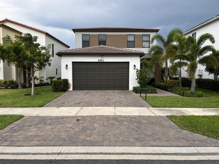 Available from Nov 5. $500 off first month incentive. Wake up to panoramic lake views in Sky Cove waterfront Seaview model! This modern 3bedroom (with two masters), 3.5 bath home offers a serene retreat and an entertainer's paradise in one. Upgraded kitchen featuring quartz countertops and dual level tile flooring, attached 2 car garage, fully fenced yard, extended paver patio, and space to lounge or gather, where lakeside sunsets become part of your everyday routine. Plus, the home is built with upgraded impact windows for added safety and efficiency.Sky Cove HOA brings resort style amenities: adult and kiddie pools, a fitness center, walking/jogging trails, parks, and full-service management. Endless family fun awaits at Westlake Adventure Park just a stroll from your front door.