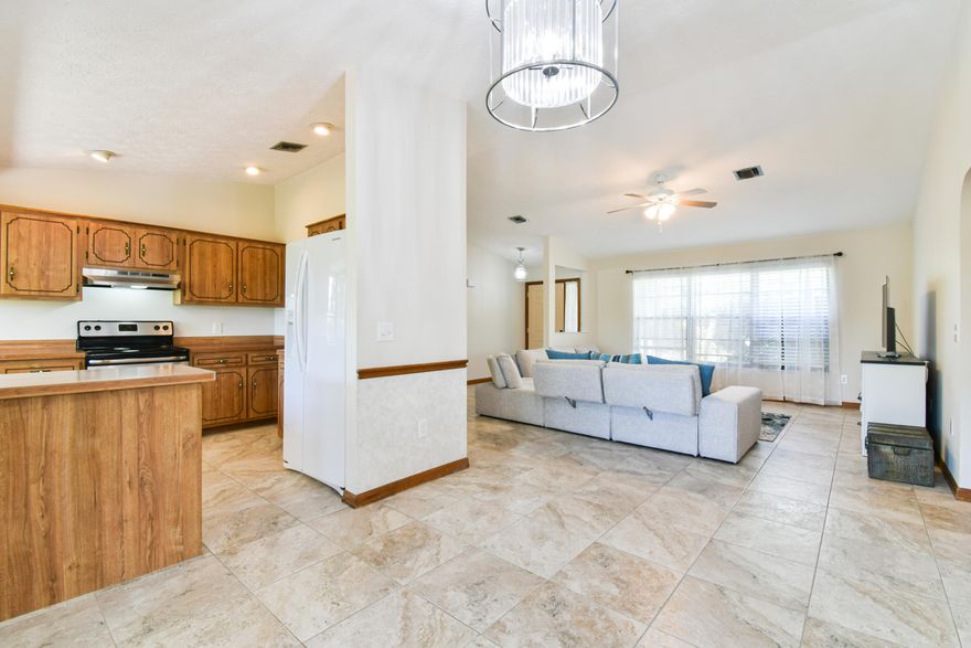 Spacious 3 Bedroom & 2 Bath Home with 1500 Living SqFt and Split Floorplan. This home features cathedral ceilings, walk-in closet, fenced yard, accordion shutters, cabana bath, French doors, and well sprinklers. There are screened porches in both the front and back of the property and a sliding screen enclosure on the garage. Ideally located, this home is close to parks, shopping, restaurants, FL Turnpike and schools.