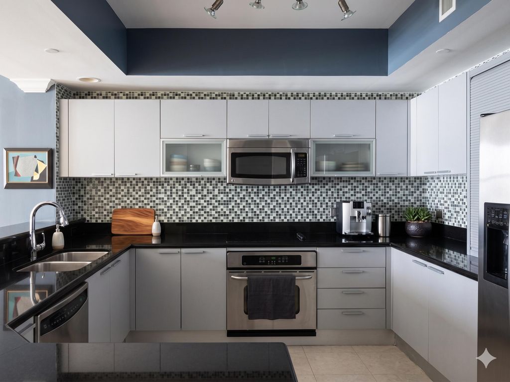 Photo of 2640 Lake Shore Drive #309, Riviera Beach, FL 33404 (MLS # B26022301)
