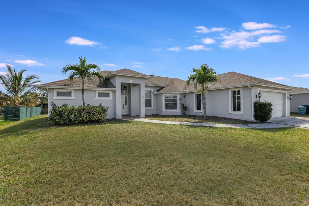 Photo of 638 SW Hamberland Avenue, Port Saint Lucie, FL 34953 (MLS # R10970229)