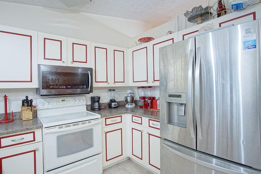 Photo of 571 SE Karrigan Terrace, Port Saint Lucie, FL 34953 (MLS # R10929181)