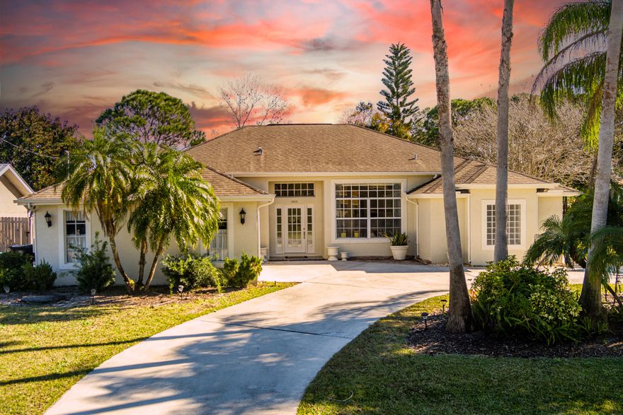 Searching for the perfect blend of space, comfort, and convenience? This meticulously maintained 4-bedroom, 2-bathroom home offers 2,345 square feet of bright, open living space designed for both effortless entertaining and large family gatherings.
Situated on a sprawling .46-acre lot with potential for splitting, this property provides outdoor flexibility for a pool or RV. You'll love the curb appeal, with large palm trees, and beautiful landscaping maintained by a deep-well irrigation system (dug to 150 feet) that ensures no rust staining, and a circular driveway for easy garage access.
Perfectly located near schools and shopping with easy access to Crosstown Parkway, and I-95.