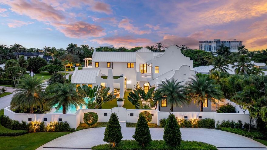 Experience the pinnacle of coastal living at 734 S Ocean Blvd, a new custom estate on a prominent corner lot moments from Delray Beach's pristine sands and vibrant Atlantic Avenue. Designed with meticulous detail, this residence showcases limestone and wide-plank white oak floors, gourmet double-island kitchen with Wolf and Sub-Zero appliances, butler's pantry, and climate-controlled wine room. The primary suite is a serene retreat with marble spa bath, while guest suites and a separate studio with full bath ensure privacy and comfort. Outdoors, enjoy expansive green spaces, a resort-style pool and spa, shell-stone drive, Bevolo lanterns, and Wolf grill. Smart home tech, two full laundries, and a three-bay garage complete this rare offering; one of Delray's most extraordinary new estates.