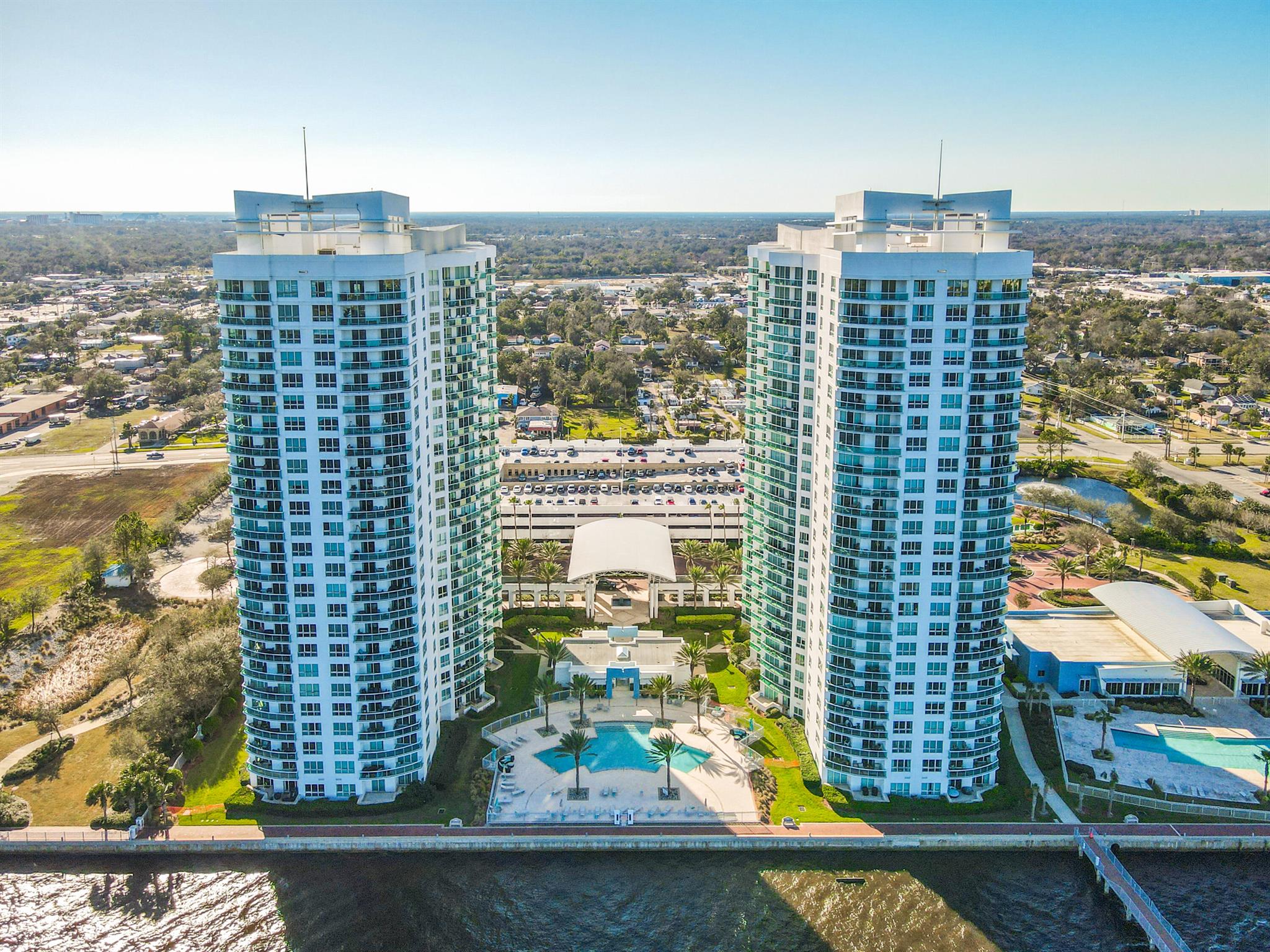 Your dream home awaits! Priced to sell fast as the lowest price unit in Marina Grande. This 1st floor unit gives you the ease to come and go as you please. Steps away from the pool, gym, movie room, library and game rooms. This unit also has a highly desired 1st floor parking space in the garage and plenty of guest parking on the 4th floor. This 2 bedroom 2 bathroom unit comes fully equipped with a washer/dryer, 3 walk in closets and new tile floors throughout. For additional storage you also have a separate indoor full AC storage closet located on the 2nd floor. Marina Grande has beautiful amenities and events included in your HOA. Cable, Internet, water, pest control and gated entrance with security for starters. Water views, great location and easy come and go access. Come take a look!